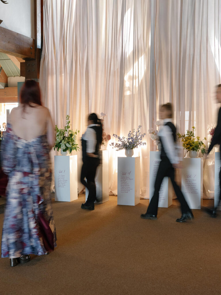 Guests finding seats at a pedestal escort display at a Little Nell Aspen wedding reception